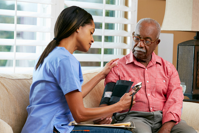 private duty nurse caring for male patient at home