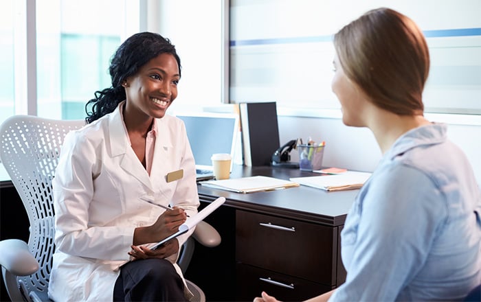 doctor meeting with female patient