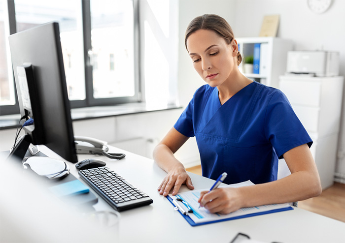 nurse writing down schedule for time management