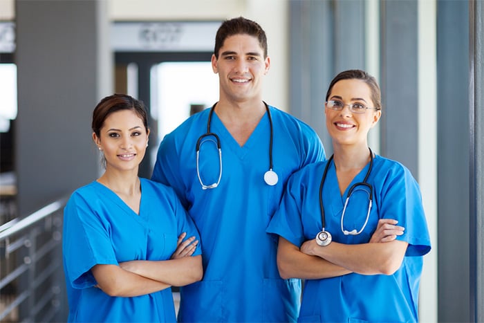 entry level healthcare worker in scrubs at hospital