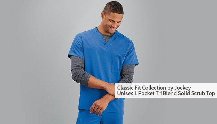 male nurse smiling wearing blue scrubs