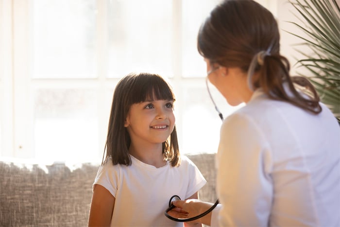 private duty nurse talking with young patient