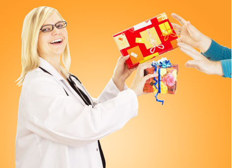 Doctors exchanging wrapped gifts