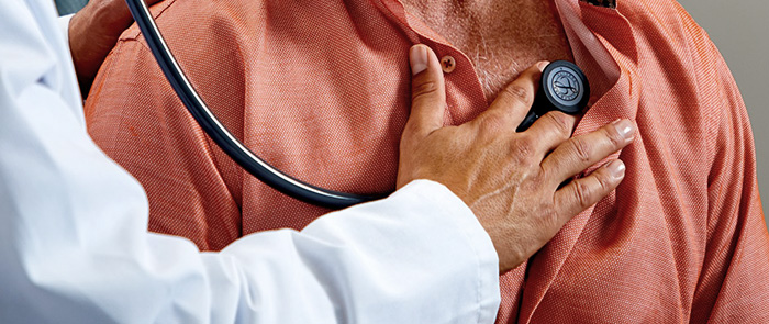 Doctor using Littmann Cardiology IV Stethoscope on patient