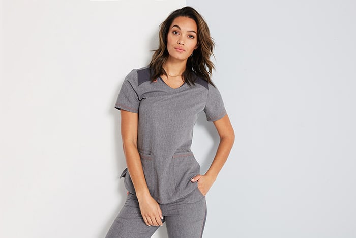 woman in stylish light gray scrubs