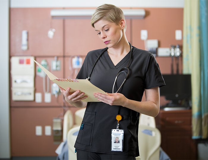 hospital worker wearing black nursing scrubs