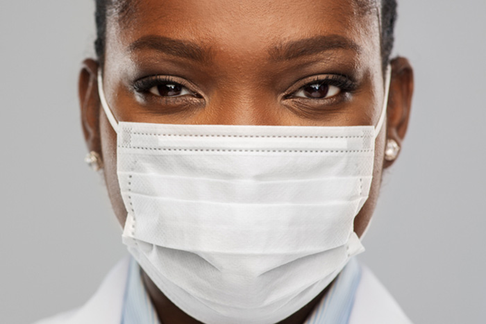 close up of masked healthcare worker